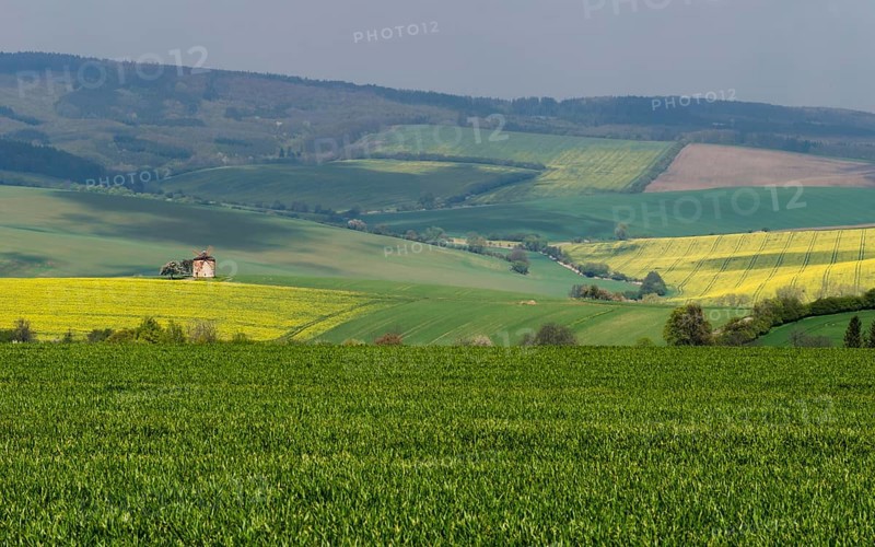 Rural abstract landscape with rolling hills and windmill in South Moravia, Czech Republic, Europe