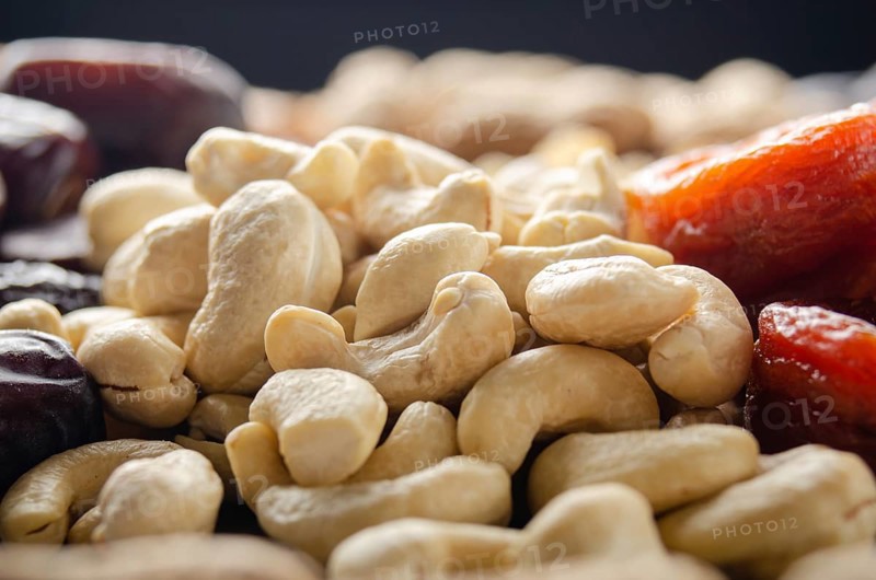 Closeup view at cashew nuts on kitchen table. Vegetarian food concept