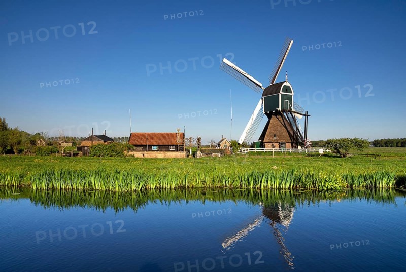Windmill the Wingerdse Molen close to the Dutch village Bleskensgraaf seen on a clear and crisp day in spring