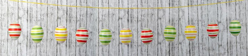 Colourful Easter eggs on a string in a row