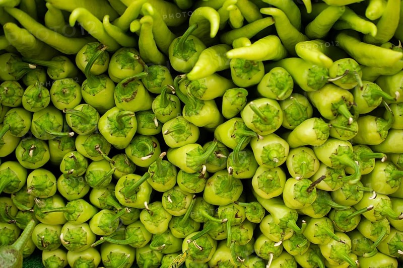 A Lot of green Peppers found as food background