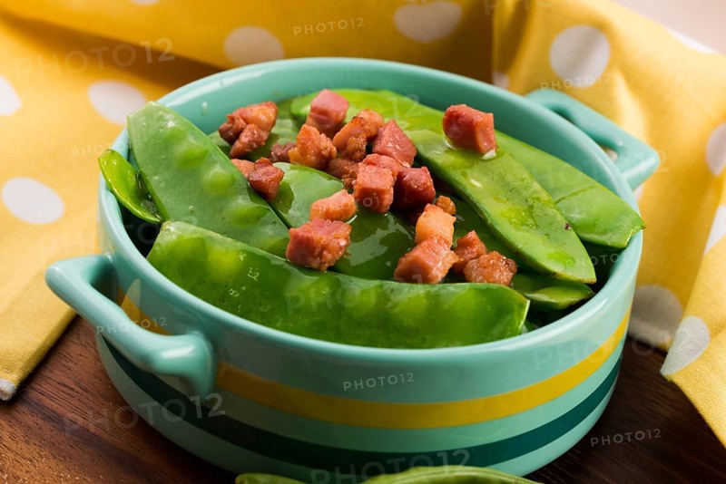 Fresh green peas with bacon