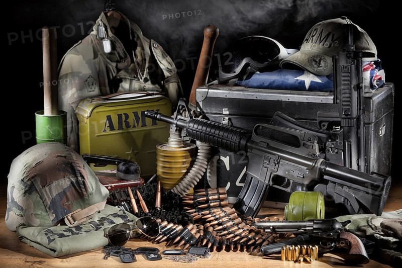 Still life with weapon, army clothing and different equipment