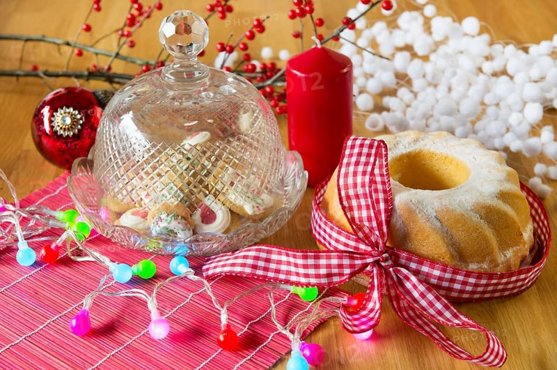 Christmas turban and cupcakes as delicatessen with colorful lights