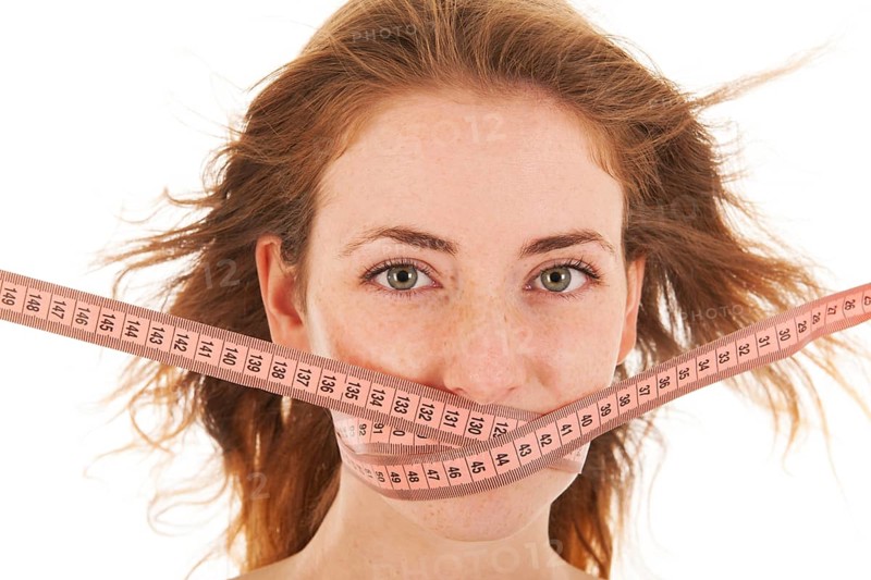 Woman with locked mouth for diet