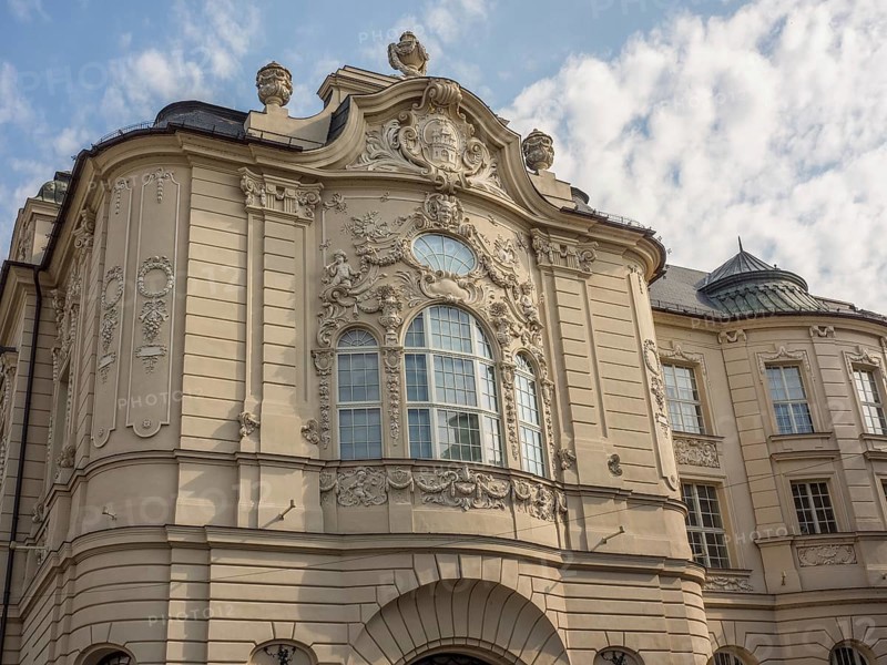 Historic building with baroque façade, elaborate reliefs and sculptures under a slightly cloudy sky, Bratislava, Slovakia, Europe