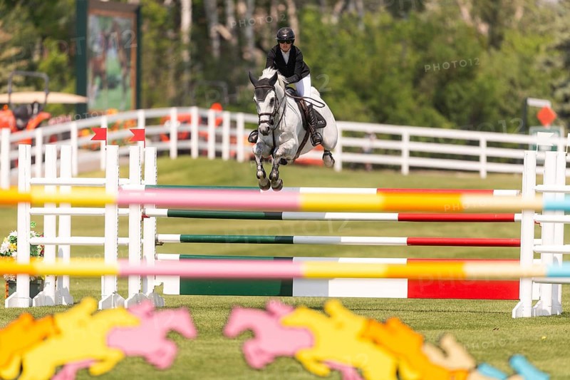 Carly Campbell-Cooper of Canada and riding Baretino, compete in the 1.60m Grand Prix during The Continental international competition at Spruce Meadows, in Calgary, Canada, North America
