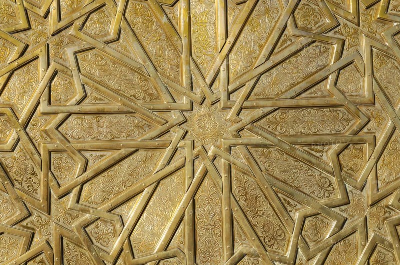 Artistically designed portal Dar el-Makhzen Place des Alaouites Fes El-Jdid, entrance area of the royal palace, close-up of a golden relief with complex geometric patterns and arabesques, Northern Morocco, Morocco, Africa