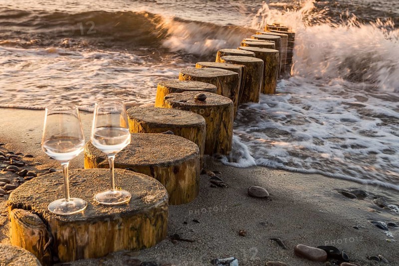 Wine on the baltic sea beach at sunset