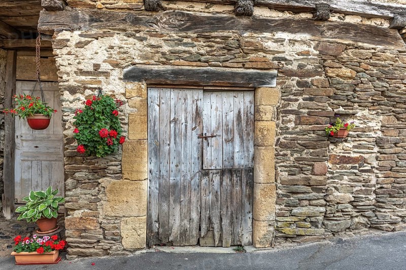 Old wall of a house in the village of Estaing. Aveyron. France