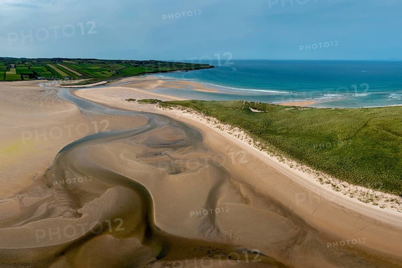 A panorama drone landscape view of the beautiful golden sand beach at Lacken Strand on the coast of North Mayo in Ireland