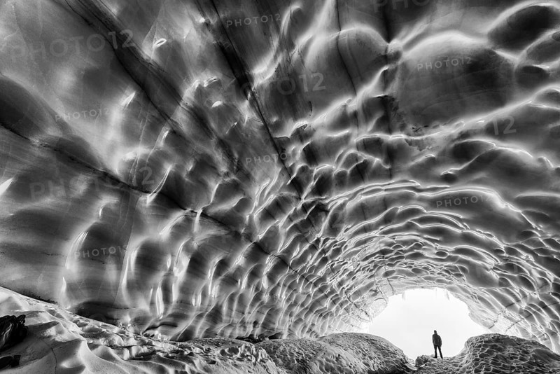 Man in an ice grotto, glacier in the Tarfaladalen valley (Darfalavaggi), Kebnekaisefjaell Norrbotten, Lapland, Sweden, September 2012, Europe