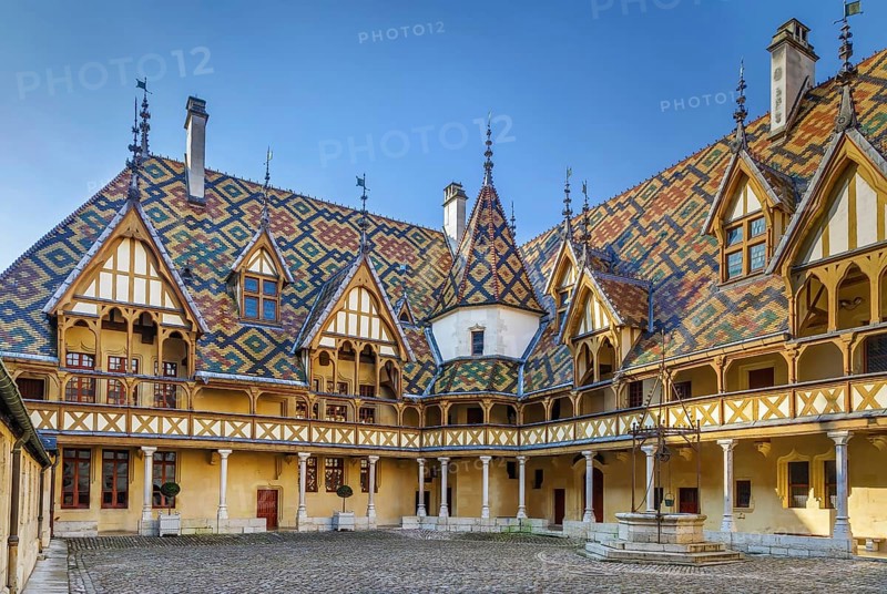 Hospices de Beaune or Hotel-Dieu de Beaune is a former charitable almshouse in Beaune, France. Courtyard, internal facade with polychrome roof