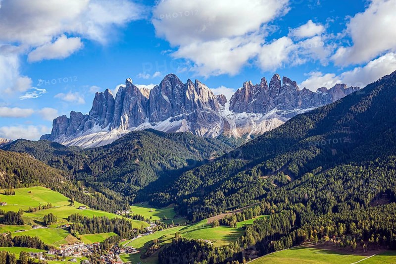 Charming old little church in the Val de Funes. Dolomites on a sunny autumn day. The beautiful village in the Dolomites Santa Maddalena