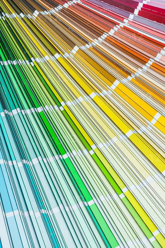 Colour pantone palette fan on wooden board top view