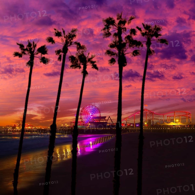 Santa Monica California sunset on Pier Ferrys wheel and reflection on beach wet sand