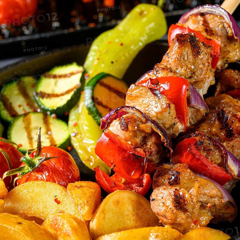 Shish kebab with various vegetables and spices Country potatoes