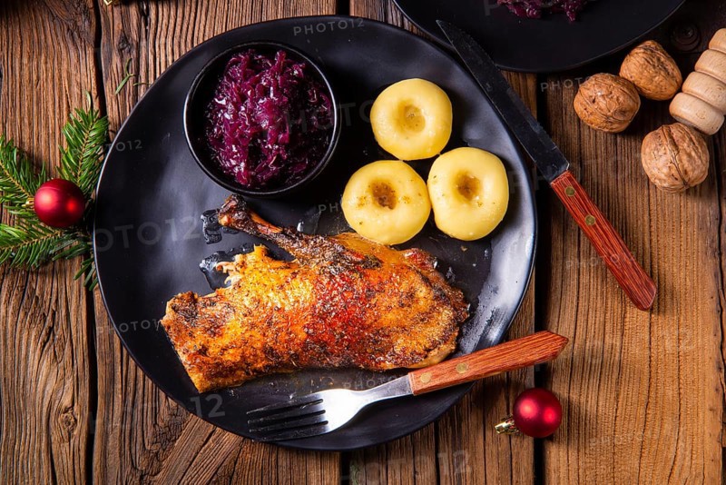 Roast goose with baked apples, red cabbage and dumplings