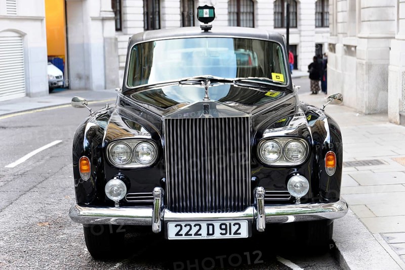 London, London Region, England, United Kingdom, Europe, Black luxury car with shiny finish in a city street, Europe