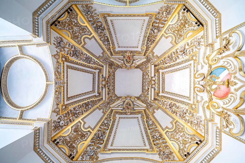 Krakow, Poland, March 23, 2024, Decorated white ceiling with gold plated ornaments, Europe