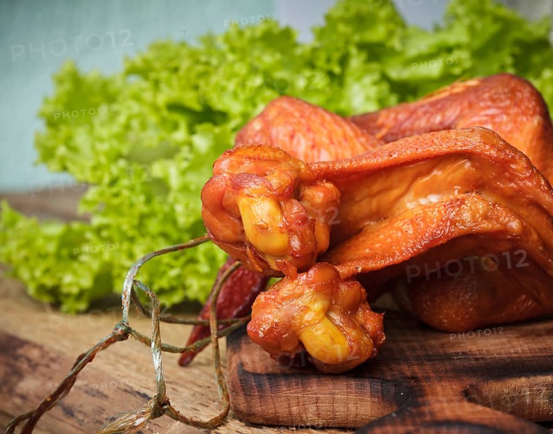 Smoked delicious chicken wings on the hardboard