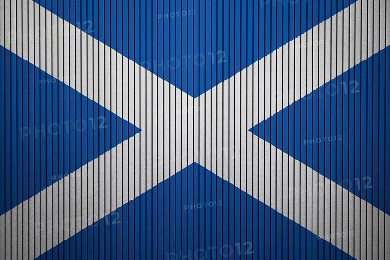 Scotland Flag painted on the cracked grunge concrete wall