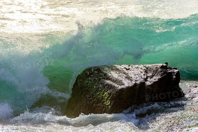 Waves breaking on the stone during sunset