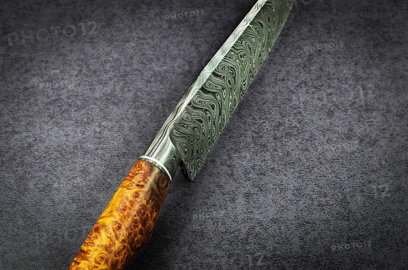 Beautiful luxurious utility knife in Texas Wind damask pattern with noble wood handle on dark background