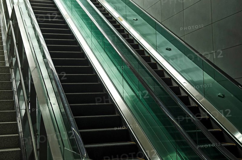Detail of modern glass and metal escalator