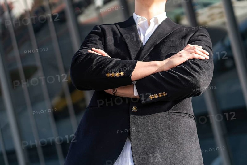 Photo of business man in classic black suit, shirt holding hands folded Achievement career wealth business concept. copy space