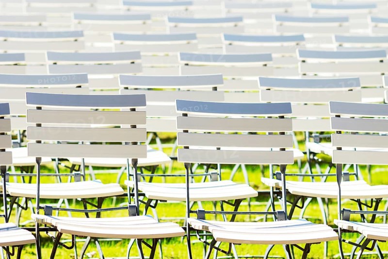 White chair rows in a spa park in black and white medium light