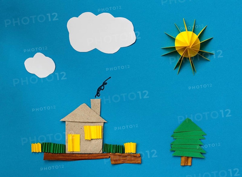 House made ??of paper over blue paper background