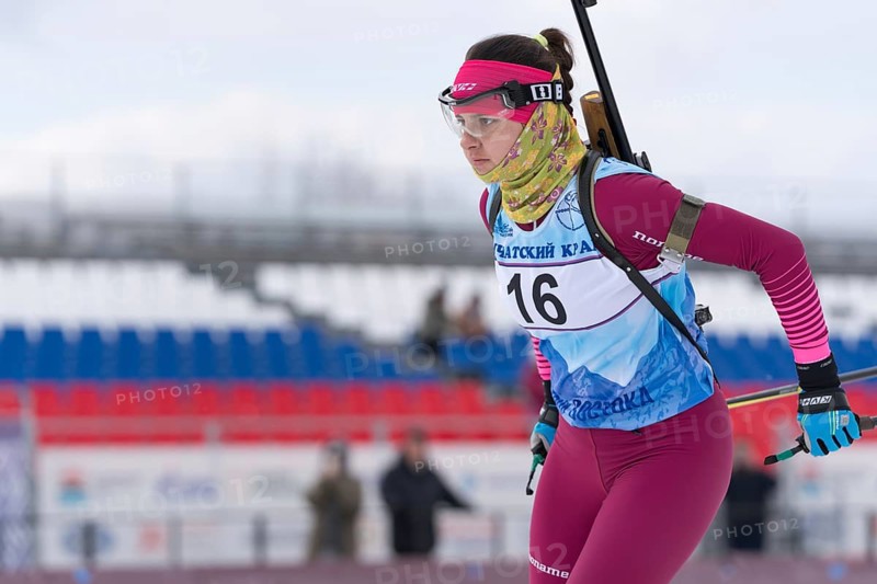 Kamchatka sportswoman biathlete Anastasia Ivchenko skiing on distance biathlon complex. Open regional youth biathlon competitions East Cup. Kamchatka Peninsula, Russian Far East, April 12, 2019