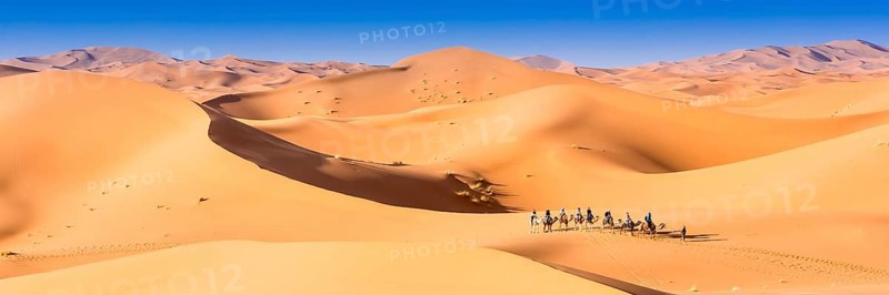 Merzouga in the Sahara Desert in Morocco. Afica. Web banner in panoramic view