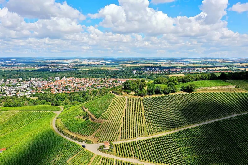 Aerial view of the Scheuerberg near Neckarsulm with its striking summit cross. Neckarsulm, Heilbronn, Baden-Württemberg, Germany, Europe
