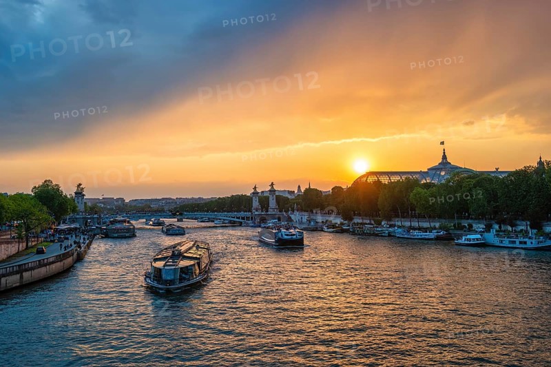 Paris France, city skyline sunset at Seine River with Pont Alexandre III bridge and Grand Palais