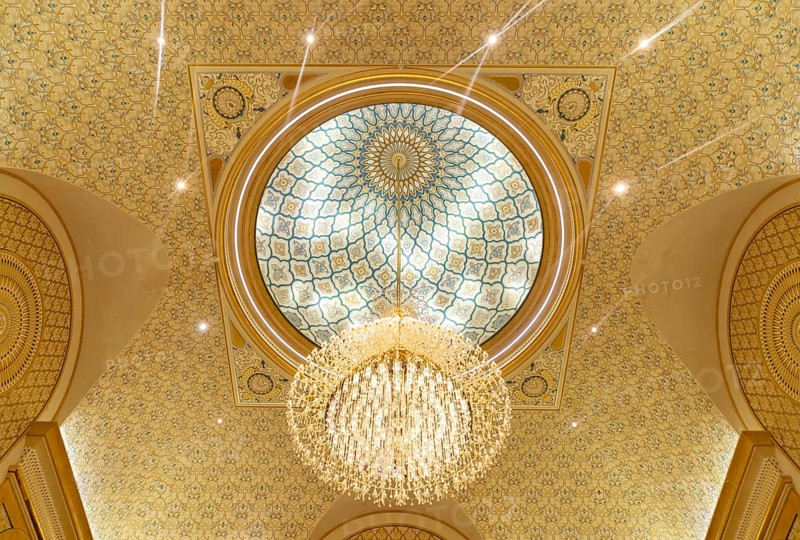 A picture of a chandelier in the ceiling of Qasr Al Watan