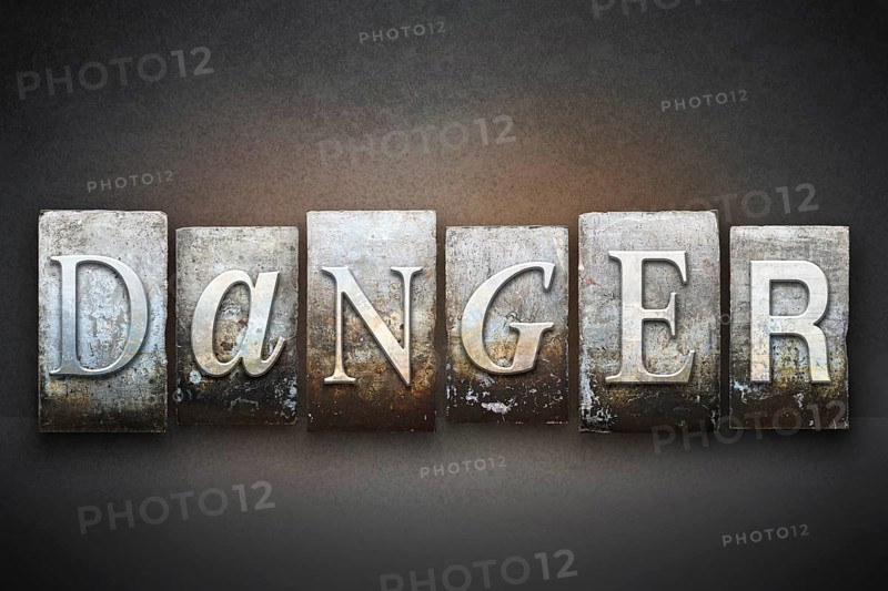 The word DANGER written in vintage letterpress type