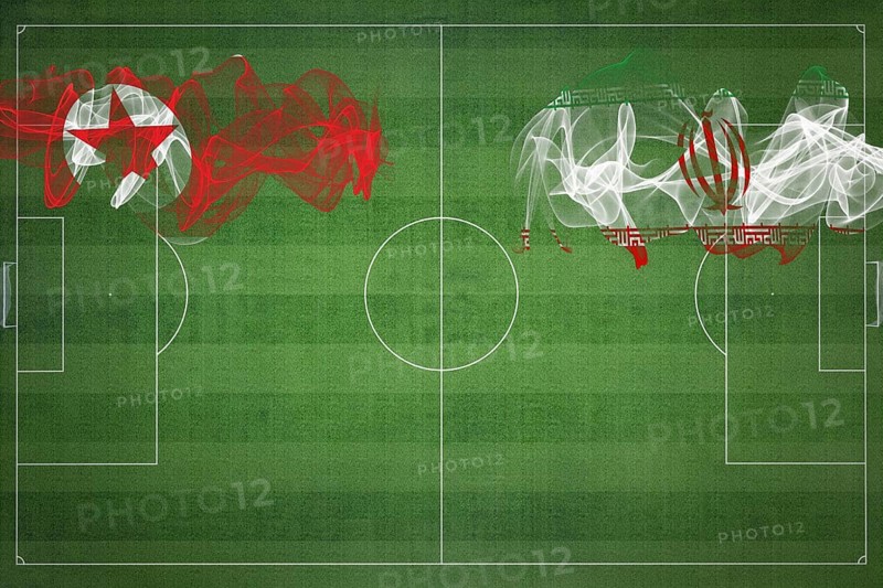 North Korea vs Iran Soccer Match, national colors, national flags, soccer field, football game, Competition concept, Copy space