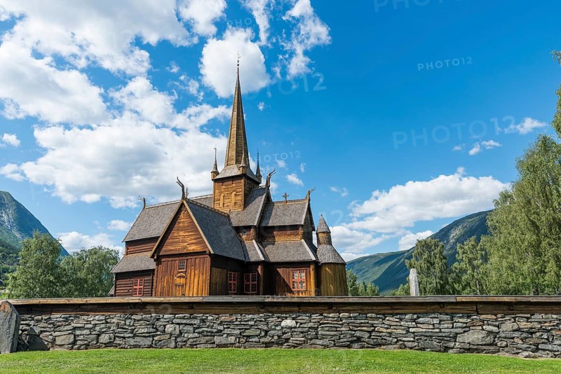 Lom stave church (Lom stavkyrkje) with graveyard foreground, Lom, Norway, Europe