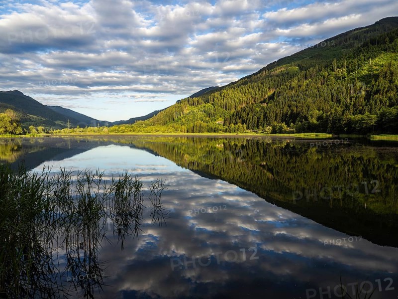 Clouds are reflected in the lake, Gaishorner See in the evening light, Gaishorn am See, Paltental, Styria, Austria, Europe