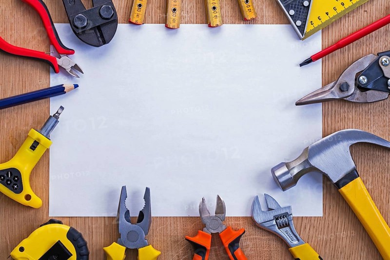 Organized copyspace horizontal version white blank sheet of paper and tools on wooden board