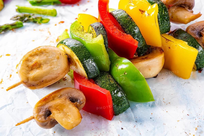 Vegetarian skewers white mushrooms, peppers and zucchini for barbecue