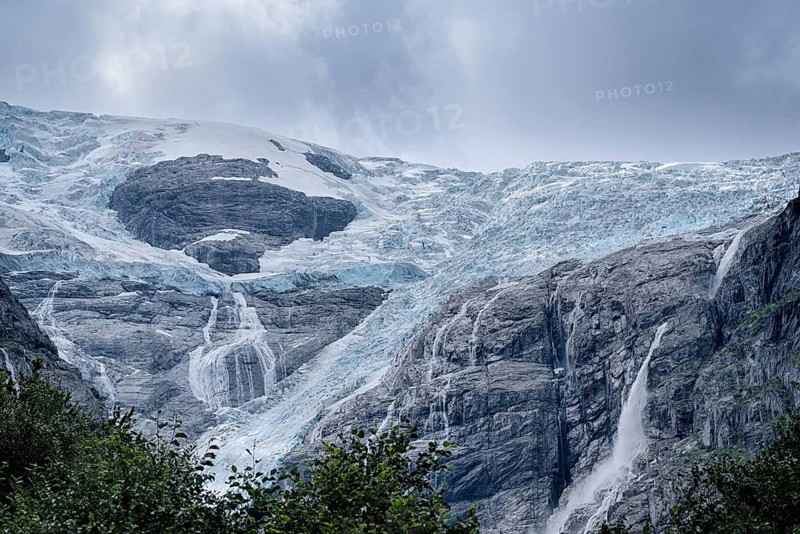 The Kjenndalsbreen is part of the Jostedalsbreen, one of the largest glaciers in Norway, and forms an impressive mountain landscape. The glacier Kjenndalsbreen in Norway is a beautiful place to travel to in summertime