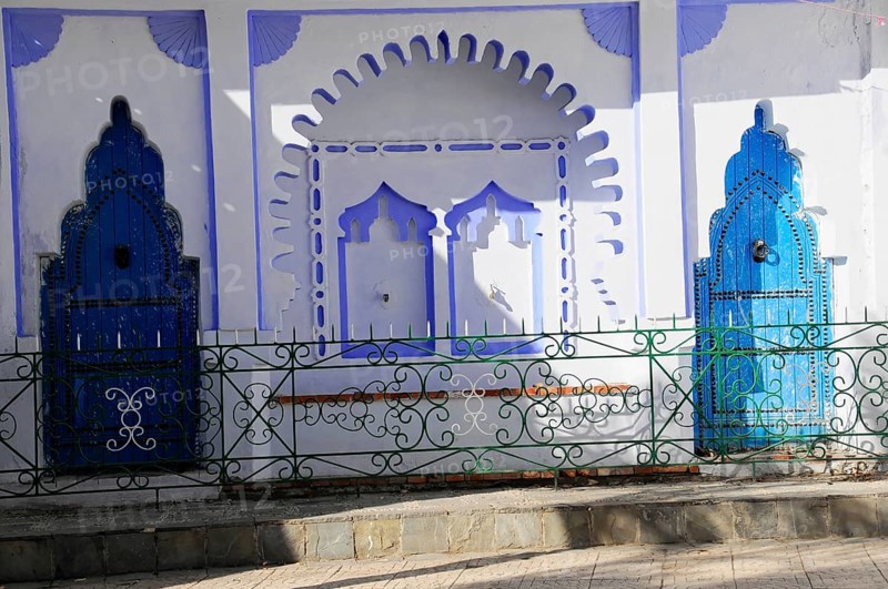 Chefchaouen, Rif Mountains, Morocco, Detail of blue ornamental doors with shadows on a white wall, Chefchaouen, Morocco, Africa