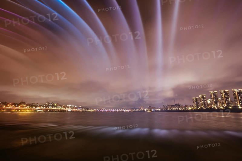 The famous Banpo Bridge is illuminated at night with water fountain display in Seoul, South Korea, Asia