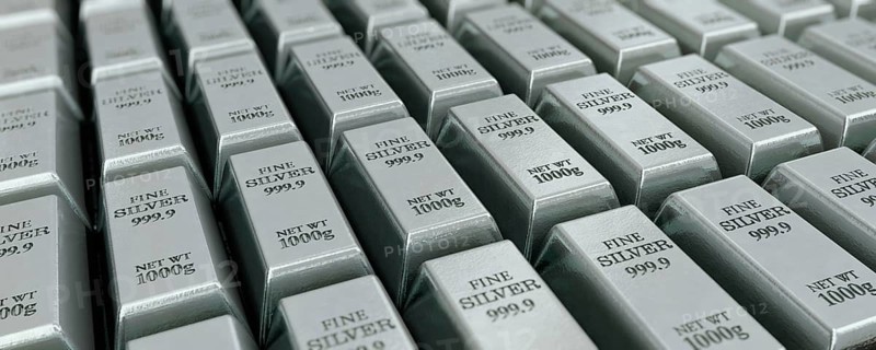 Lots of stacked silver bars