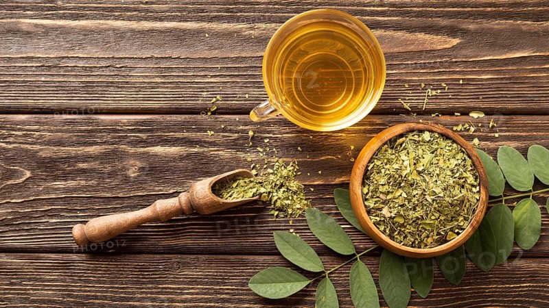 Flat lay green leaves cup tea