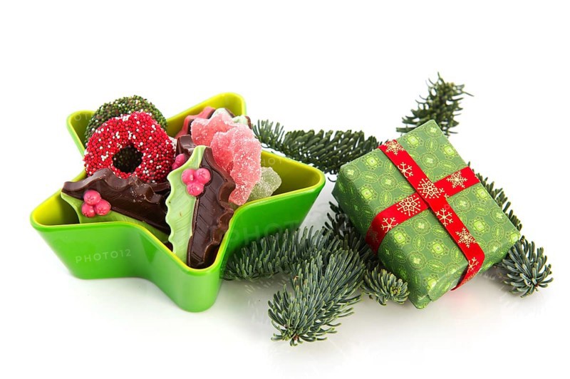 Green star full with christmas chocolate and present