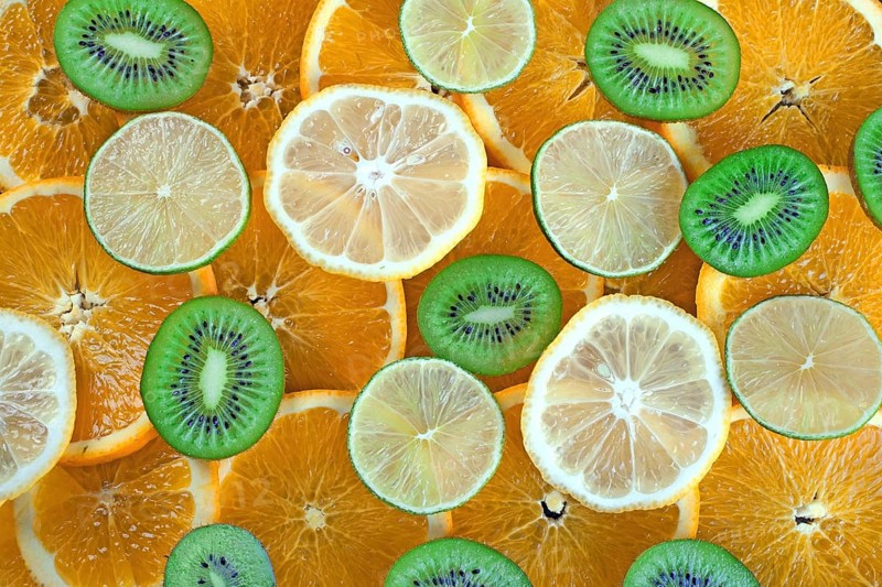 Kiwi, lime, lemon, orange slices background